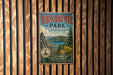 A vintage metal sign for Vulkaneifel Park in Germany, featuring a scenic landscape with a lake and mountains.