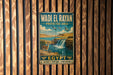 A vintage metal sign with the text "Wadi El Rayan" and "PROTECTED AREA" is displayed on a wooden wall.