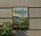 A metal sign on a wall that reads "Waqoit Bay National Estuarine Research Reserve" and "Massachusetts", with a bird illustration.