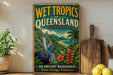 A vintage-style sign advertising the Wet Tropics of Queensland, Australia, featuring a colorful illustration of a bird, palm trees, and a waterfall.