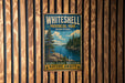A vintage metal sign for Whitheshell Provincial Park, featuring a scenic image of a forest and a lake.