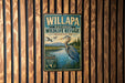 A vintage-style metal sign for the Willapa National Wildlife Refuge in Washington, featuring a large blue heron and a scenic landscape.