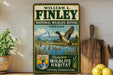 A vintage-style sign for the National Wildlife Refuge in Oregon, featuring a duck in flight over a lake and mountains in the background.