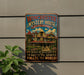 A vintage-style metal sign for the Winchester Mystery House in San Jose, California, featuring an illustration of the house and the text "Built in Mystery and to Baffle the Spirits Amaze the World!"