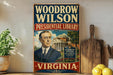 A vintage-style sign for the Woodrow Wilson Presidential Library in Virginia, featuring an illustration of a man in a suit and tie.