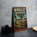 A vintage-style metal sign for Wrigley mansion in California, featuring an illustration of the mansion and palm trees.