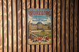 A vintage metal sign with the text "Würzburg Residence with the Court Gardens of the Residence Square" and "GERMANY" is displayed on a wooden wall.
