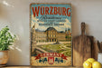 A vintage-style metal sign advertising Würzburg Residence with the Court Gardens in Residence Square, featuring an illustration of the Würzburg Residence and its gardens.