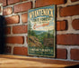 A vintage-style metal sign for Wyantenock State Forest in Connecticut, featuring a scenic landscape with mountains, trees, and a river.