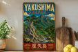 A vintage-style poster of Yakushima, Japan, featuring a scenic mountain landscape with a river and lush greenery. The poster is displayed on a wall, surrounded by various kitchen items such as a cutting board, a lemon, and a potted plant.