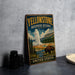 A vintage-style sign for Yellowstone Biosphere Reserve, featuring a scenic illustration of a bison in the foreground and a geyser in the background, with the text "Yellowstone Biosphere Reserve" and "United States" prominently displayed.