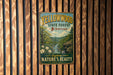 A vintage-style sign for the Yellowwood State Forest in Indiana, featuring a scenic image of a forest and a river.