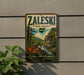 A vintage-style metal sign for Zaleski State Forest in Ohio, featuring a scenic landscape with a waterfall and lush greenery.