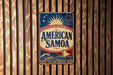 A vintage-style sign for "American Samoa" is displayed on a wooden wall.