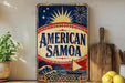 a vintage-style sign for "American Samoa" with a sailboat and tropical landscape, placed on a shelf next to a wooden cutting board and some lemons.