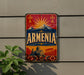 A vintage-style sign with the word "ARMENIA" prominently displayed, featuring a mountain landscape and a sunburst design.