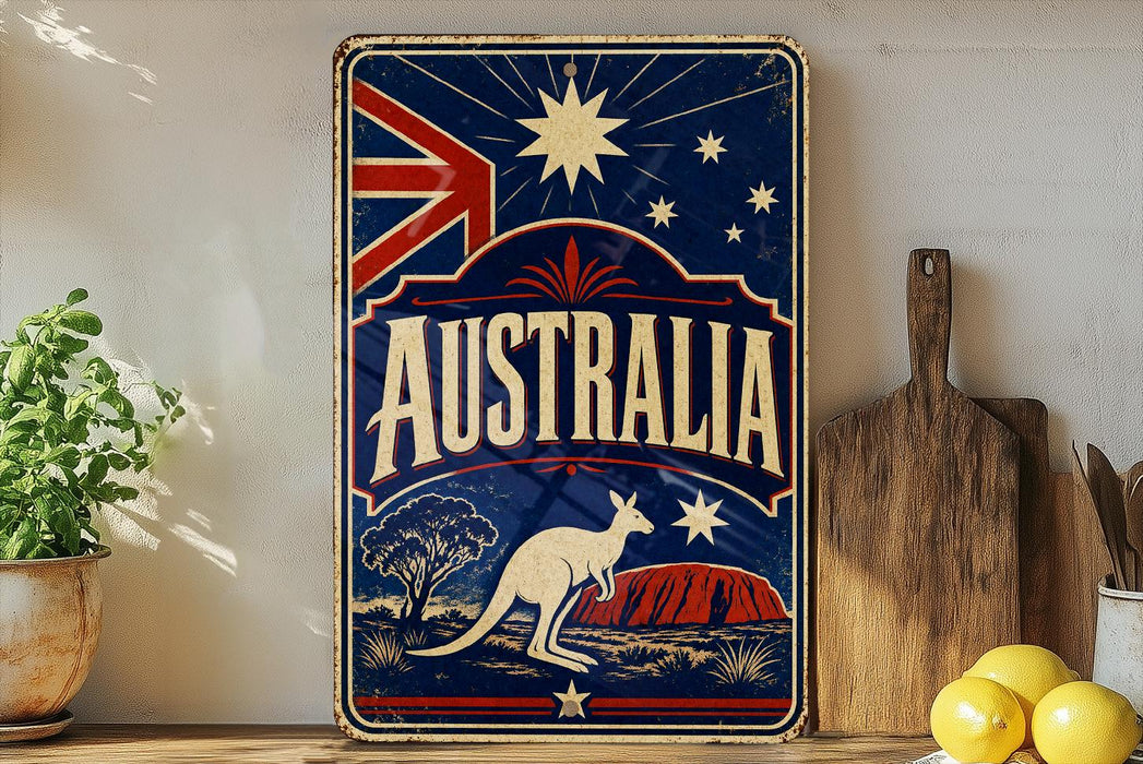 A vintage-style metal sign with the word "AUSTRALIA" prominently displayed, featuring a kangaroo and a night sky with stars. The sign is placed on a shelf next to a wooden cutting board and some lemons.