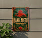 a vintage-style sign with the word "BANGLADESH" prominently displayed, surrounded by various decorative elements such as a sun, palm trees, and a lotus flower.