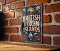 A vintage-style sign that reads "BRITISH VIRGIN ISLANDS" is displayed on a brick wall.