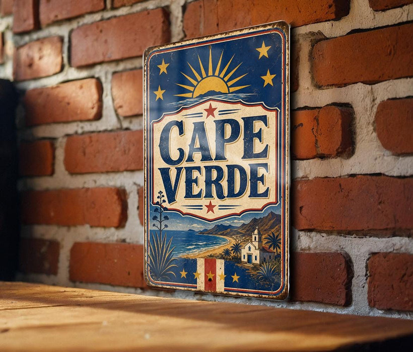 A vintage metal sign with the word "CAPE VERDE" displayed prominently, featuring a sun and stars design, is mounted on a brick wall.