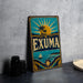 A vintage metal sign with the word "Exuma" prominently displayed, featuring a tropical beach scene with palm trees and a sun.