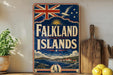 A vintage-style sign for Falkland Islands, featuring a Union Jack flag, a penguin, and a scenic landscape.