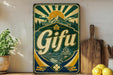 A vintage-style metal sign with a sun and mountain design, featuring the word "Gifu" prominently displayed.