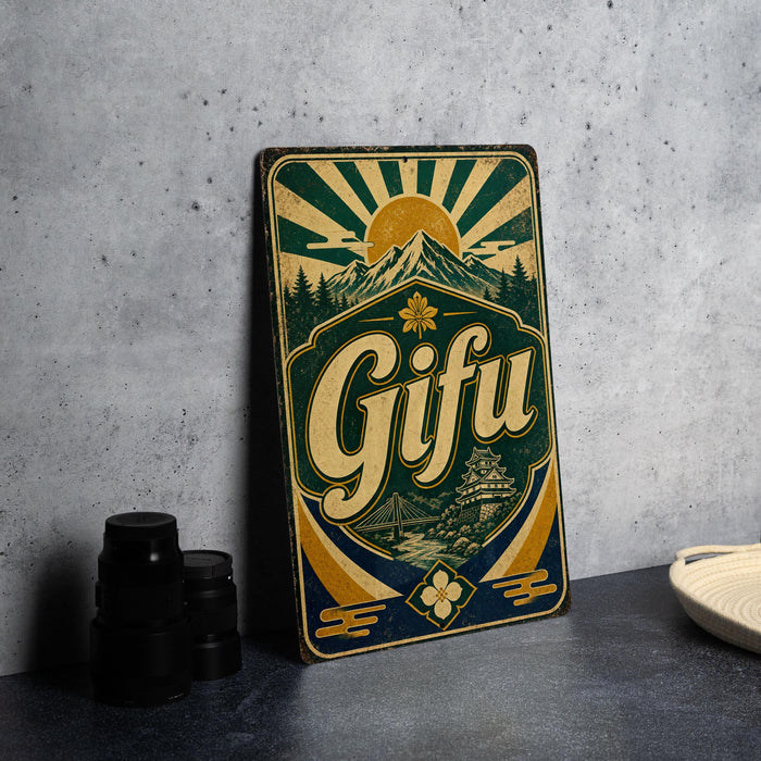 A vintage-style metal sign with the word "Gifu" prominently displayed, featuring a sunburst design and a mountain landscape.