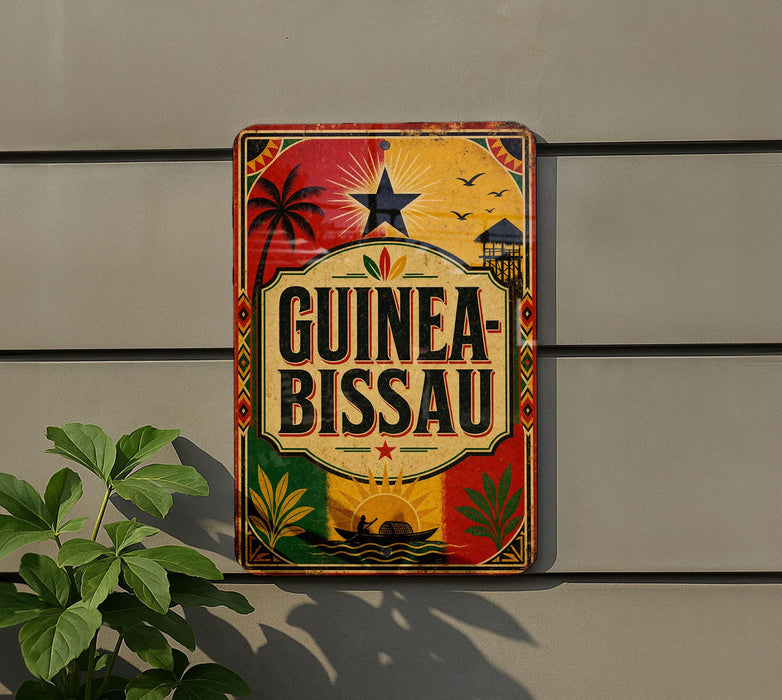 A colorful sign with the text "GUINEA-BISSAU" displayed prominently on a wall, with various decorative elements such as palm trees, a sun, and a boat.