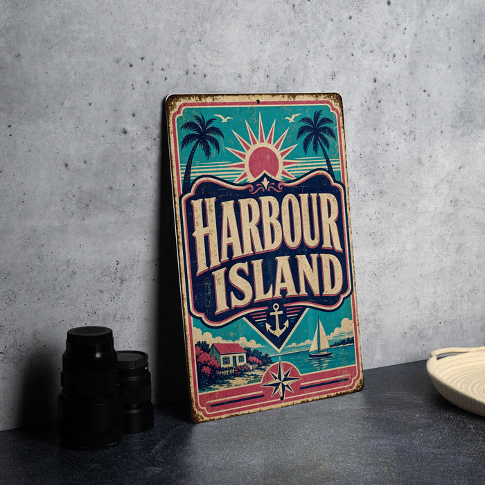 A vintage-style metal sign with the text "HARBOUR ISLAND" is displayed on a table, accompanied by a stack of black camera lenses and a white dish.
