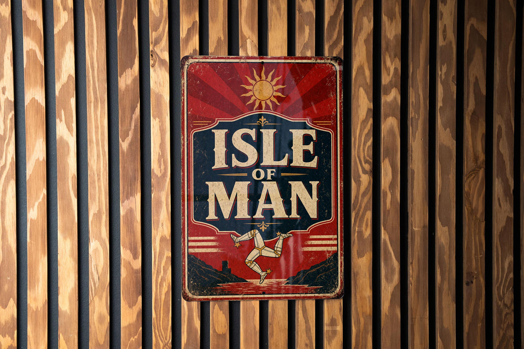 A vintage-style sign with the text "ISLE OF MAN" displayed prominently against a wooden background.