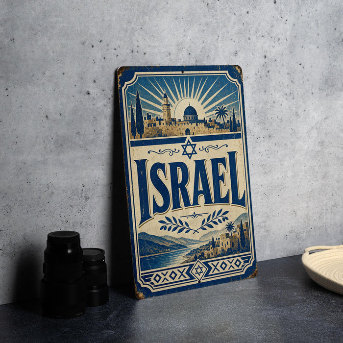 A vintage-style metal sign with the word "ISRAEL" prominently displayed, featuring an illustration of a cityscape and a sunburst design.