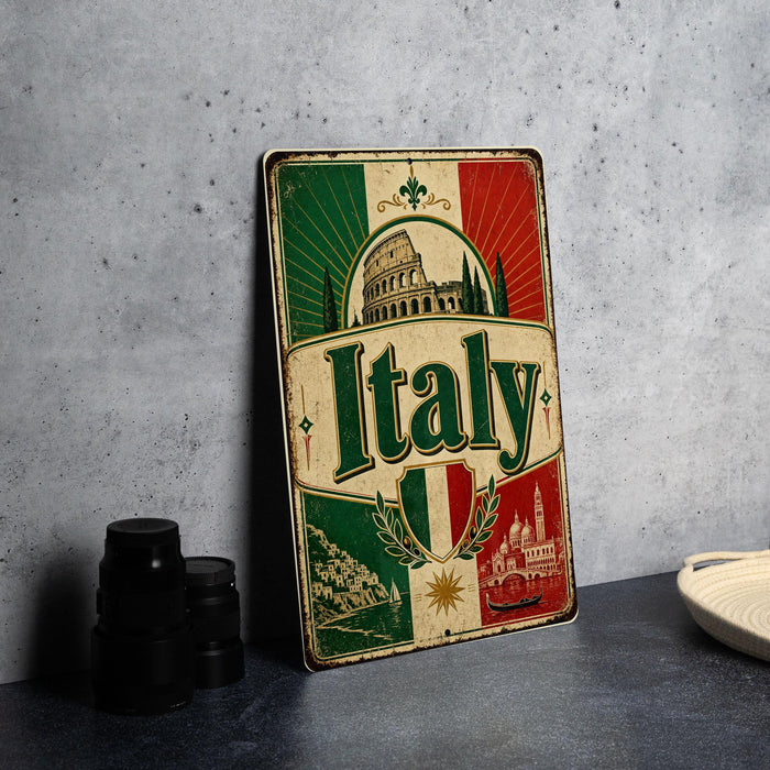 A vintage-style metal sign with the word "Italy" prominently displayed, featuring a combination of green, red, and white colors, along with images of landmarks and architecture.