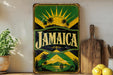 A vintage Jamaica-themed metal sign is displayed on a shelf, surrounded by kitchen utensils and a potted plant.