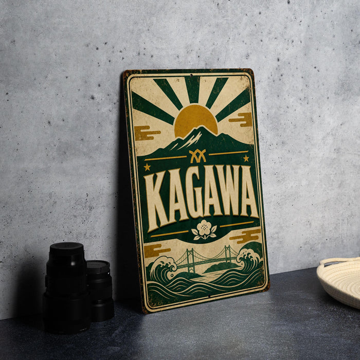 A vintage metal sign with the word "KAGAWA" prominently displayed, featuring a sun and mountain design.
