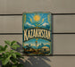a vintage-style sign with the word "Kazakhstan" prominently displayed, along with a sun and mountains in the background.