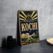 A vintage-style metal sign with the word "Kochi" prominently displayed, featuring a sunburst design and various nautical elements.
