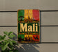 a colorful sign with the word "Mali" prominently displayed, surrounded by various cultural and architectural elements such as a sun, buildings, and a camel.