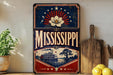 A vintage-style sign for Mississippi, featuring a large flower and a steamboat, is displayed on a shelf next to a wooden cutting board and some lemons.