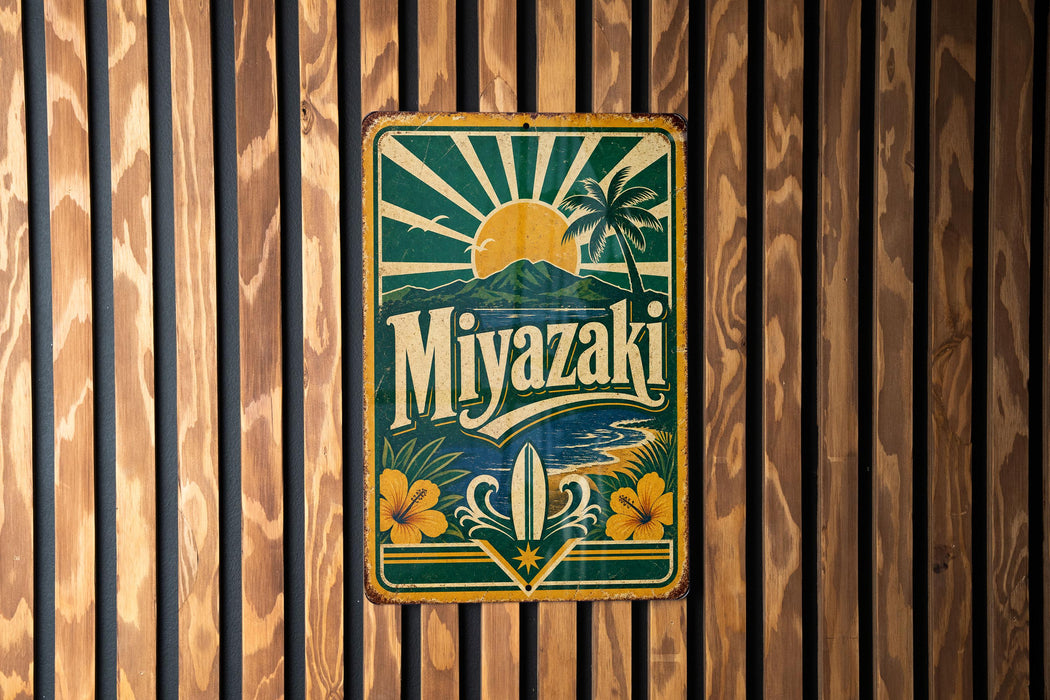 A vintage-style metal sign with the text "Miyazaki" displayed prominently in the center, surrounded by tropical elements such as palm trees and a sun.