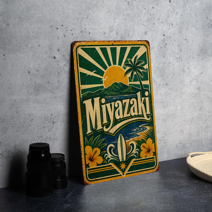 A vintage-style metal sign with a tropical beach scene and the word "Miyazaki" prominently displayed.