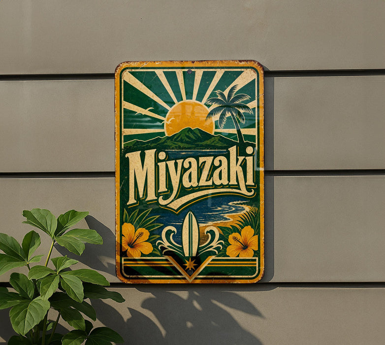 A vintage-style metal sign with a tropical beach scene and palm trees, featuring the word "Miyazaki" prominently displayed.
