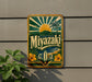 A vintage-style metal sign with a tropical beach scene and palm trees, featuring the word "Miyazaki" prominently displayed.