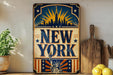 A vintage-style metal sign with the text "NEW YORK" prominently displayed, featuring an illustration of the Statue of Liberty and a city skyline.