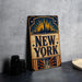 A vintage-style metal sign with the text "NEW YORK" prominently displayed, featuring an illustration of the Statue of Liberty and a city skyline.