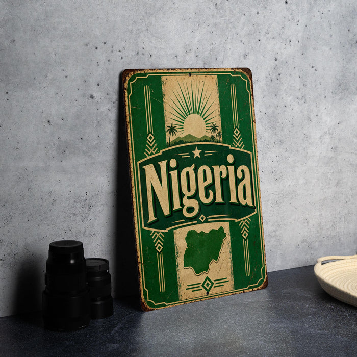A vintage-style metal sign with the word "Nigeria" prominently displayed, featuring a map of the country and decorative elements.