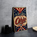 A vintage-style metal sign with the word "Ohio" prominently displayed, featuring a city skyline and stars in the background.
