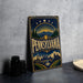 A vintage-style metal sign with the word "PENNSYLVANIA" prominently displayed, featuring a scenic illustration of the state's landscape and architecture.