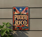 A vintage-style sign with the text "PUERTO RICO" displayed prominently, featuring a red, white, and blue color scheme with a palm tree and a lighthouse.