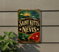 A vintage-style sign for Saint Krits and Nevis, featuring a tropical landscape with palm trees, a sun, and stars.